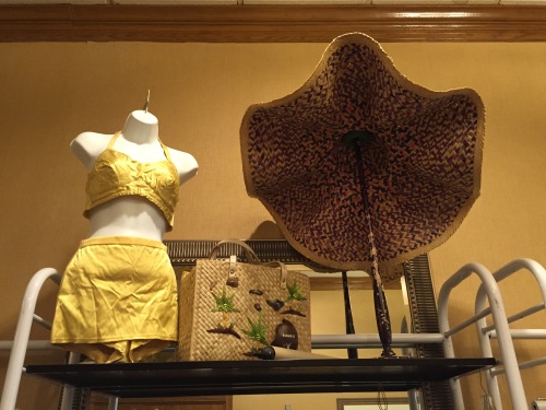 Gold bathing suit and the biggest sun hat I've ever seen, at Flower Child.